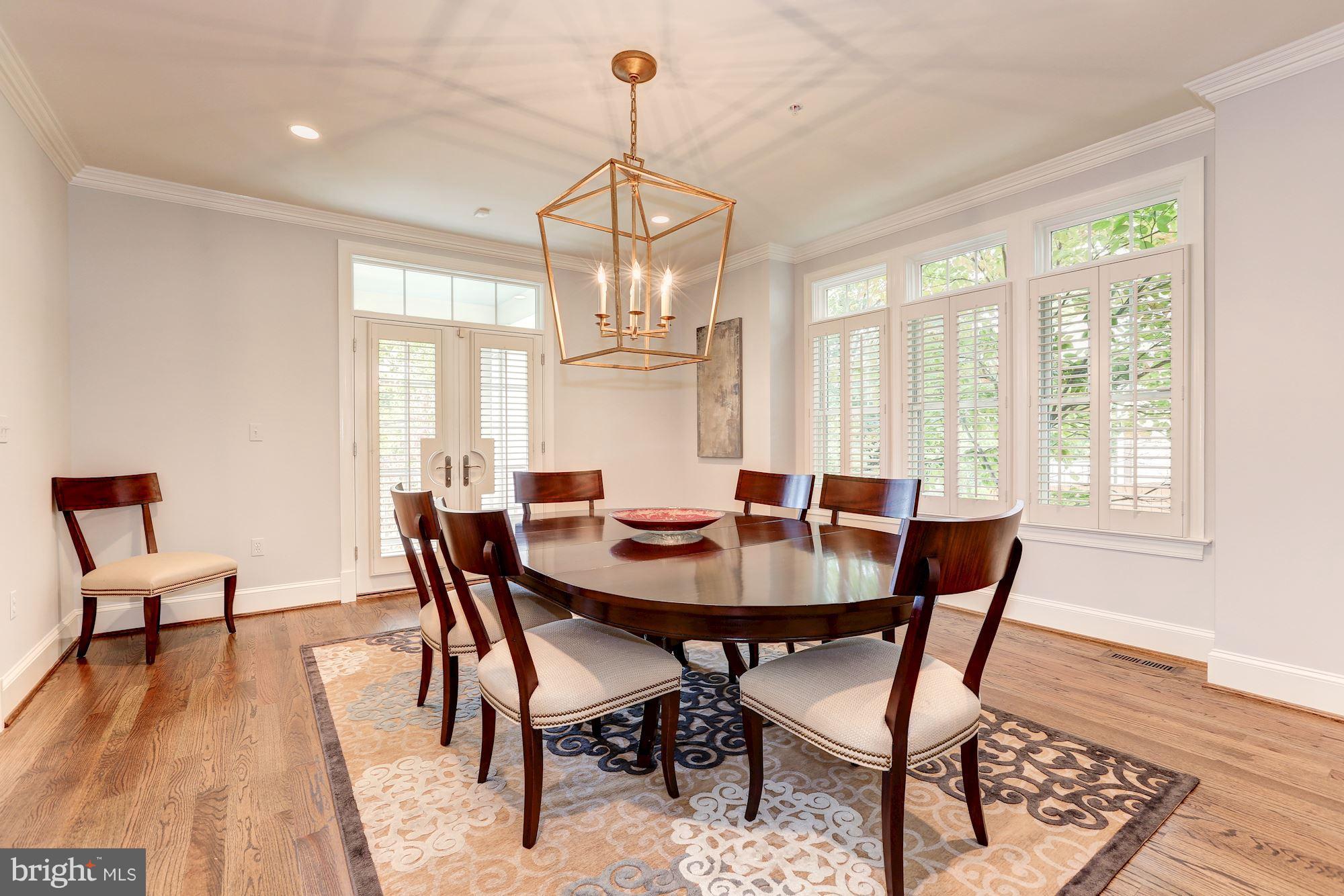 7003 Brookville Road Chevy Chase, MD 20815 - Photo 10 of 30 a view of a dining room with furniture window and wooden floor
