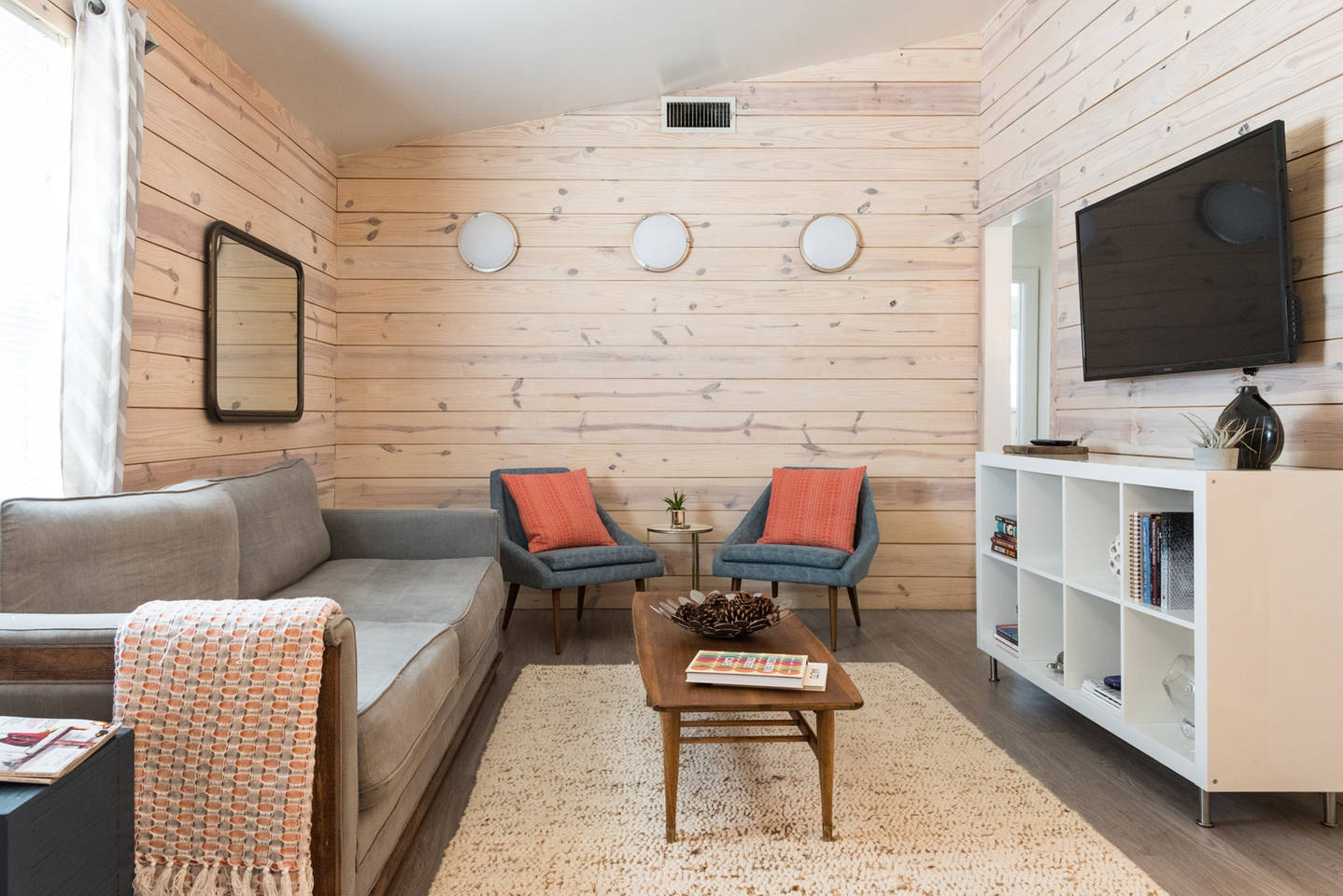 1913 Rabb Road, Unit A Austin, TX 78704 - Photo 1 of 1 Warm wood-paneled walls and a vaulted ceiling create a cozy, cabin-like ambiance.