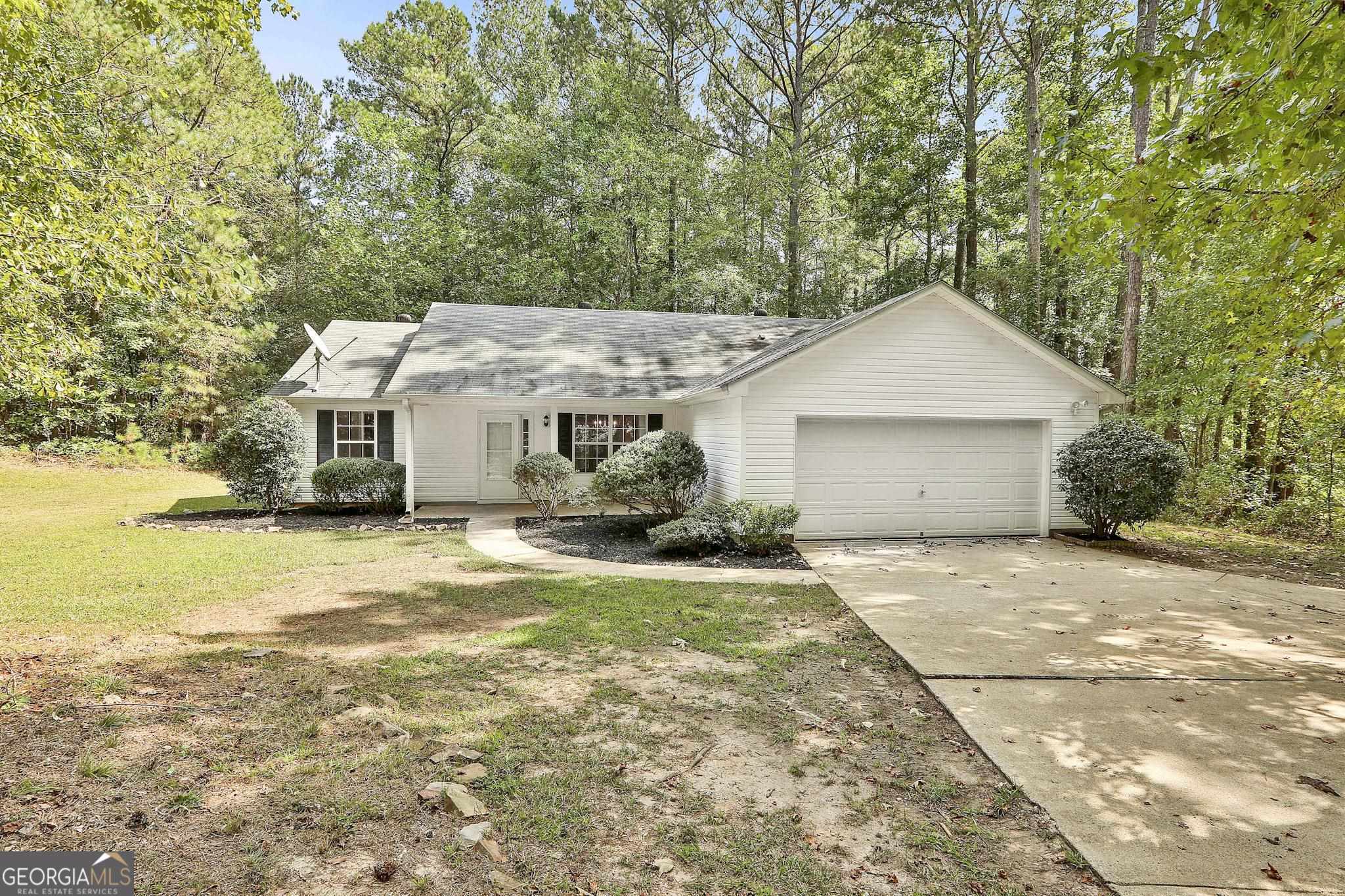 1107 Allen Road Grantville, GA 30220 - Photo 1 of 1 a front view of a house with a yard and garage
