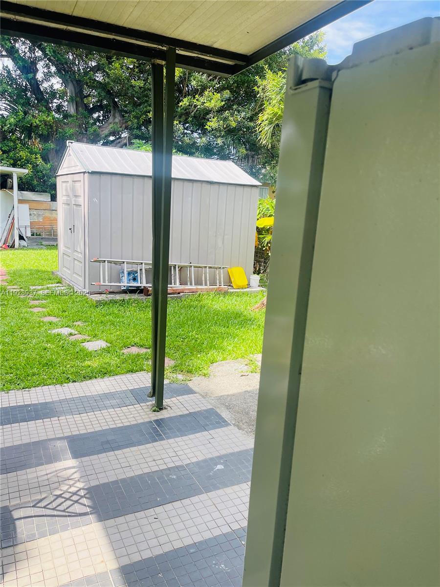 2045 Northwest 34th Street Miami, FL 33142 - Photo 12 of 12 a view of a porch with a yard