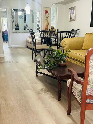 a kitchen with granite countertop cabinets stainless steel appliances and a sink