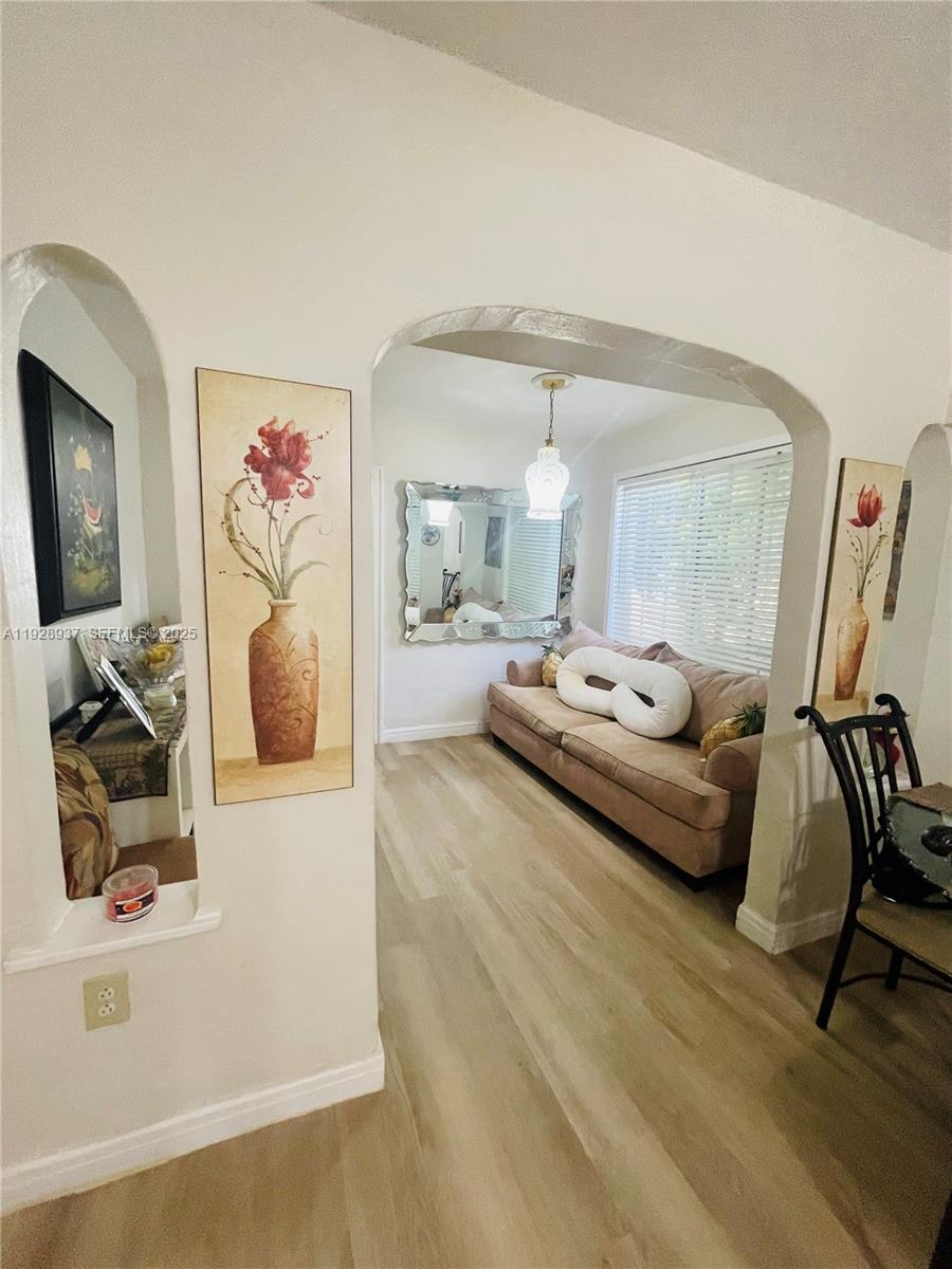 2045 Northwest 34th Street Miami, FL 33142 - Photo 9 of 12 a living room with furniture and a flat screen tv