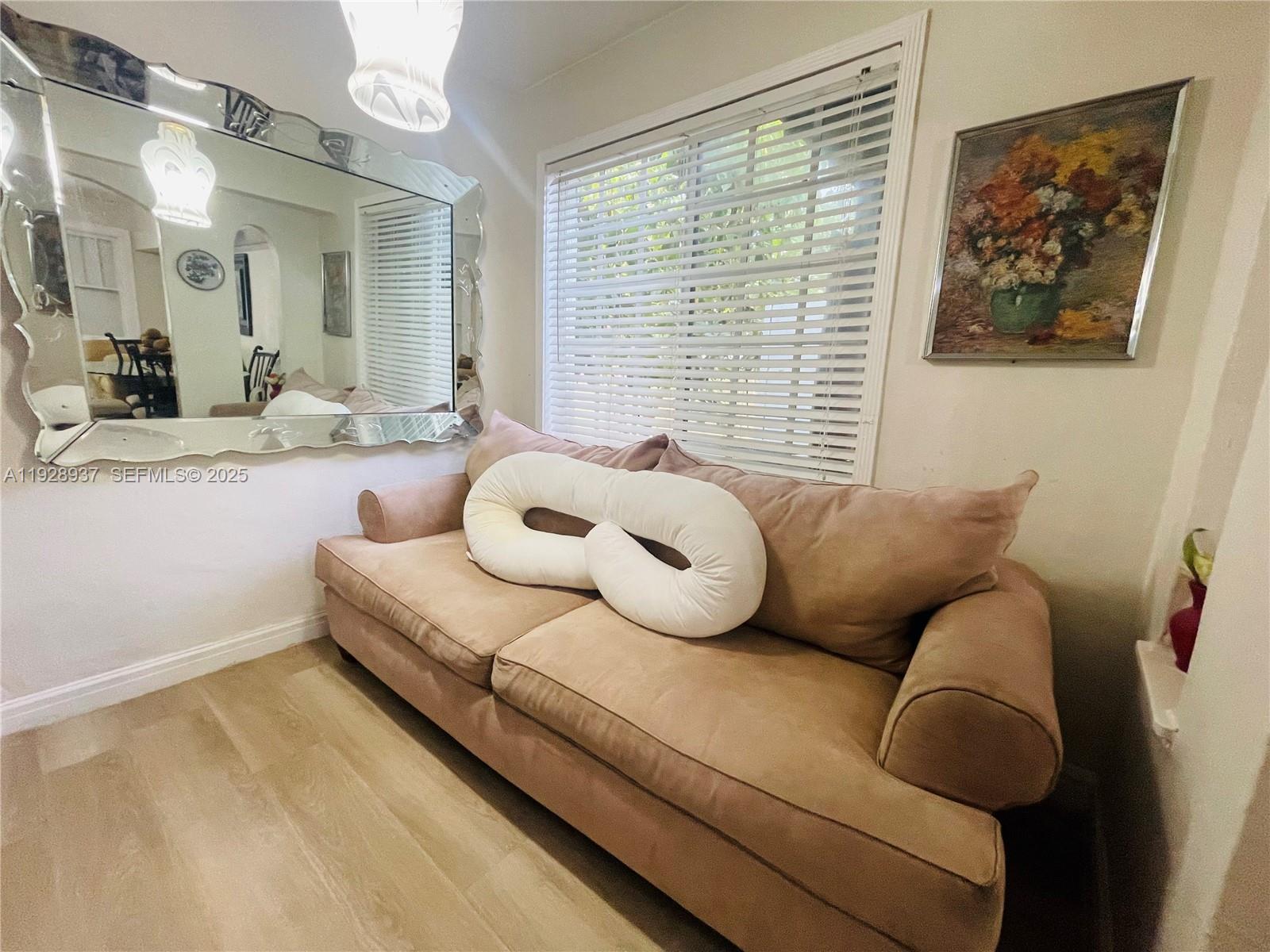 2045 Northwest 34th Street Miami, FL 33142 - Photo 10 of 12 a living room with furniture and a large window