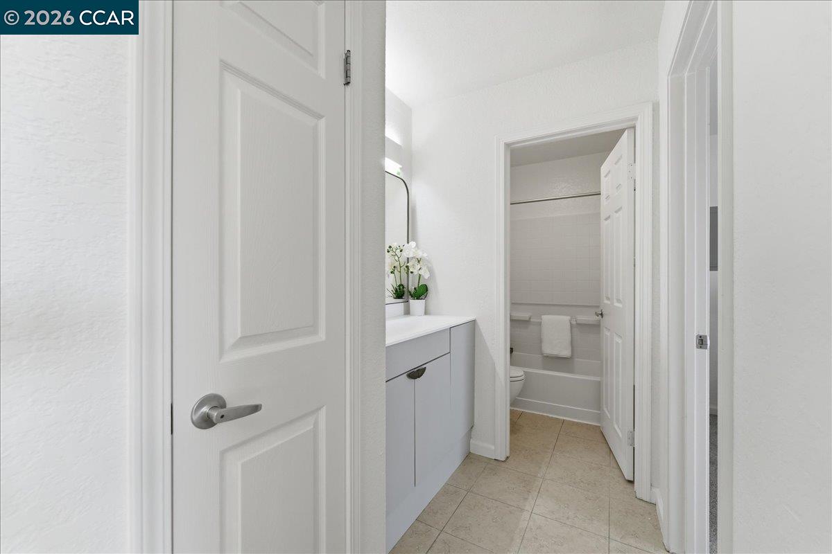 4740 Appian Way, Unit 9 El Sobrante, CA 94803 - Photo 17 of 23 a bathroom with a granite countertop sink