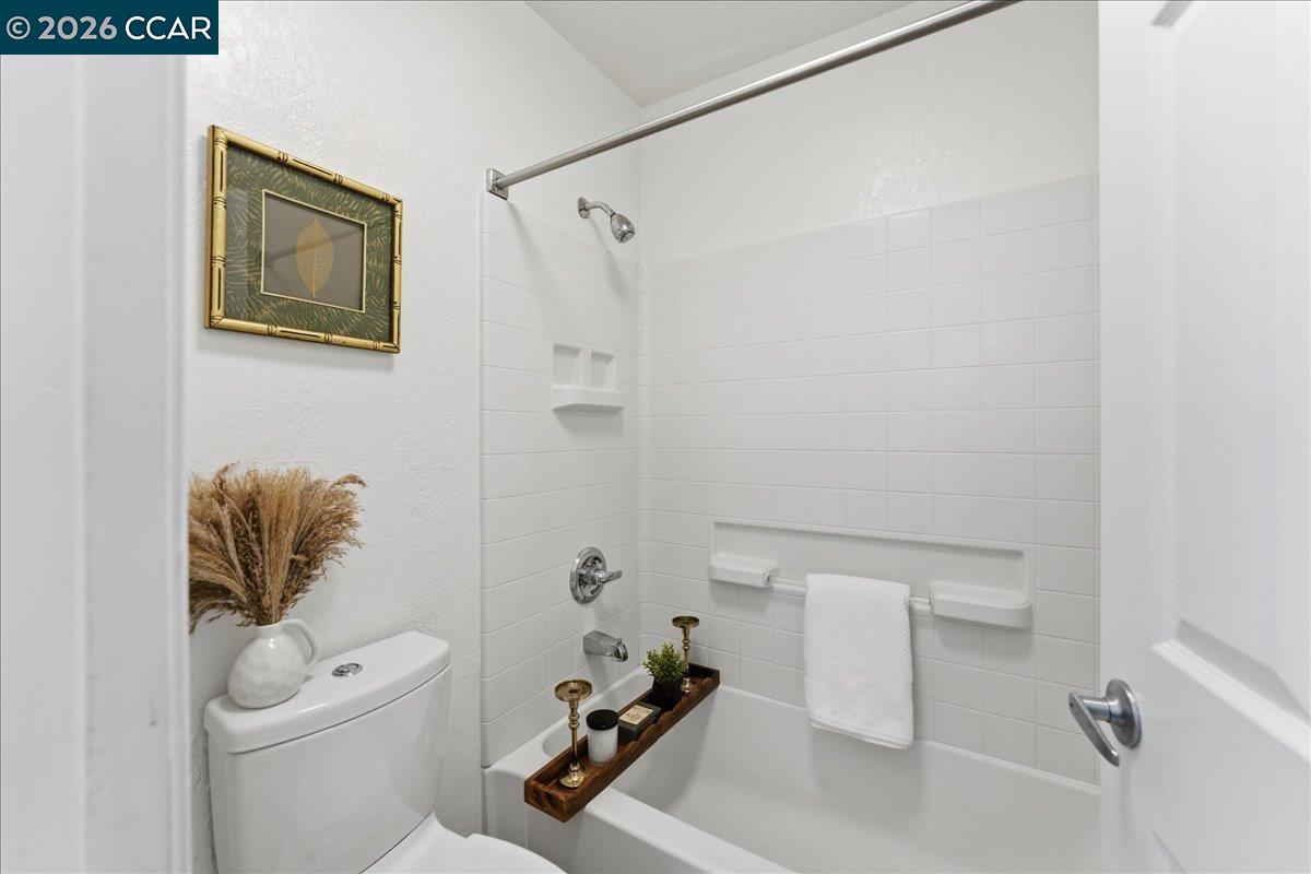 4740 Appian Way, Unit 9 El Sobrante, CA 94803 - Photo 19 of 23 a bathroom with a sink a toilet and shower