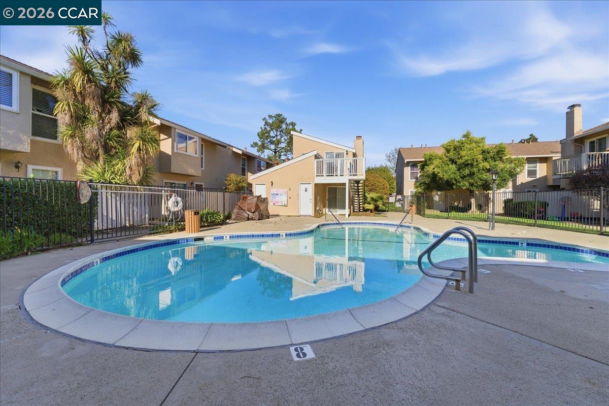 4740 Appian Way, Unit 9 El Sobrante, CA 94803 - Photo 21 of 23 a view of a swimming pool with a yard