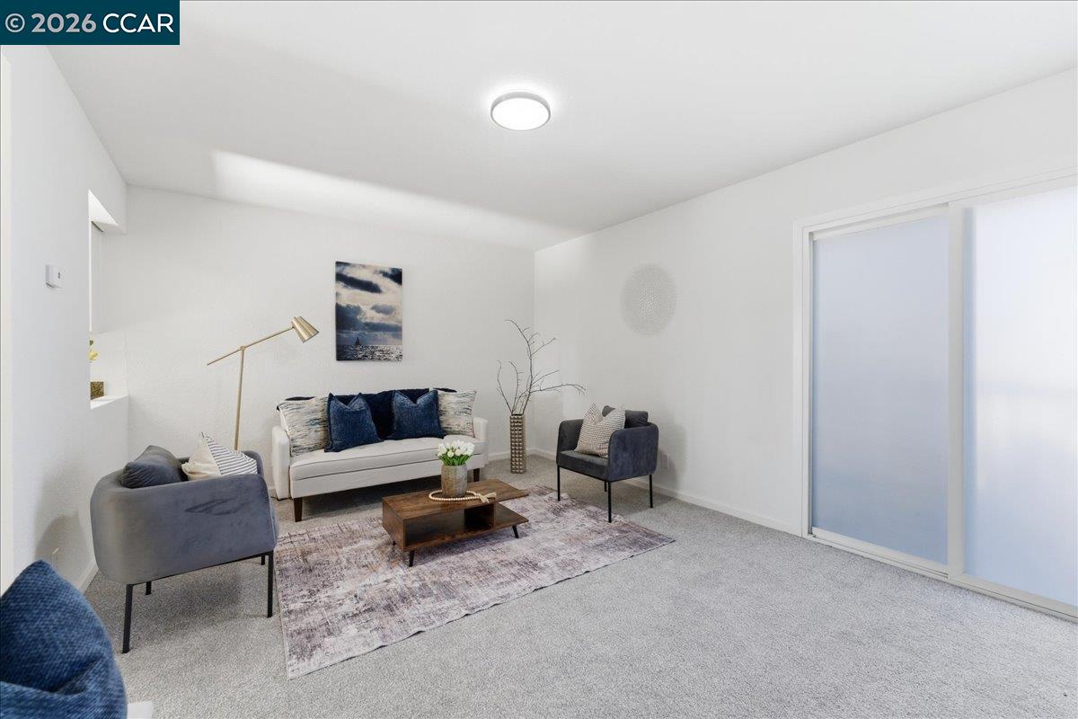 4740 Appian Way, Unit 9 El Sobrante, CA 94803 - Photo 5 of 23 a living room with furniture and a lamp