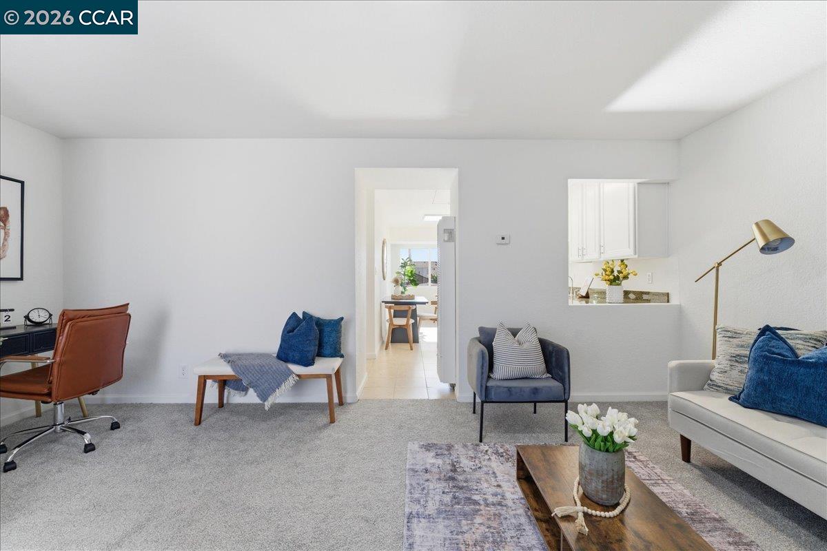 4740 Appian Way, Unit 9 El Sobrante, CA 94803 - Photo 7 of 23 a living room with furniture and a rug