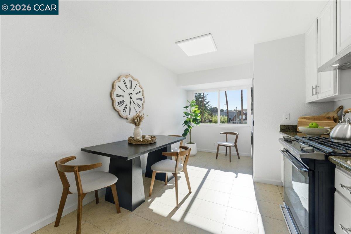 4740 Appian Way, Unit 9 El Sobrante, CA 94803 - Photo 8 of 23 a view of a dining room with furniture and a window