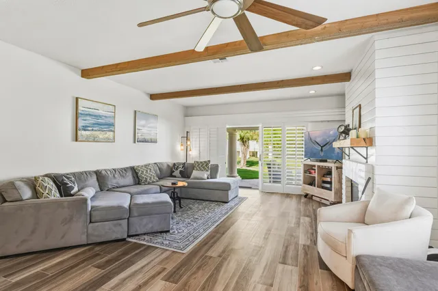 a living room with furniture and a large window