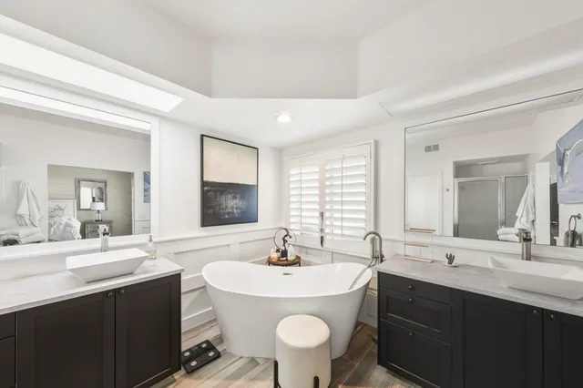 a bedroom with a bed and a chair