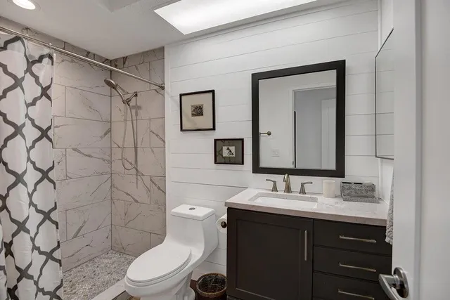 a view of a patio with couches chairs potted plants and a big yard