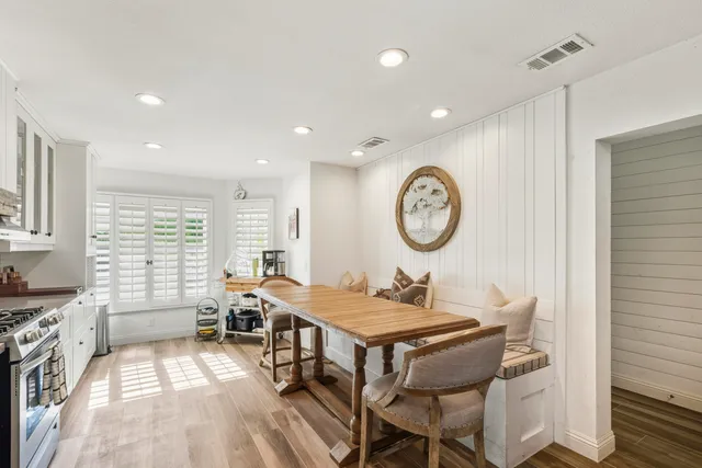 a stove top oven sitting inside of a kitchen
