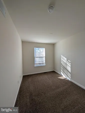 a white toilet sitting next to a bath tub