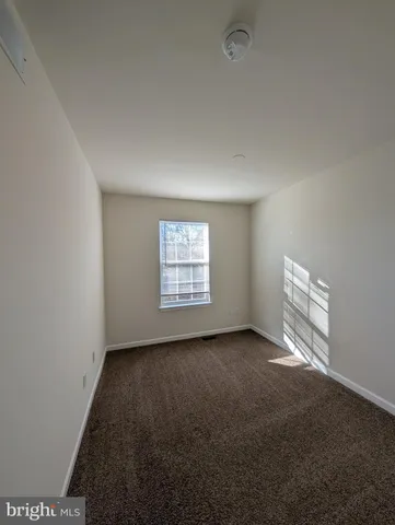 a white toilet sitting next to a bath tub