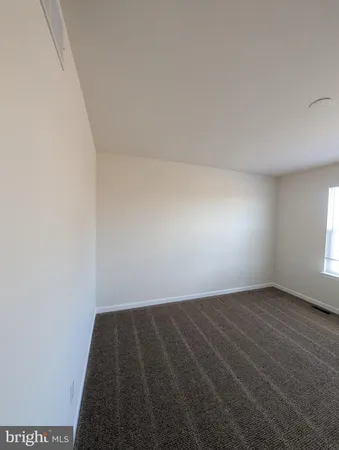 a view of balcony with wooden floor and fence