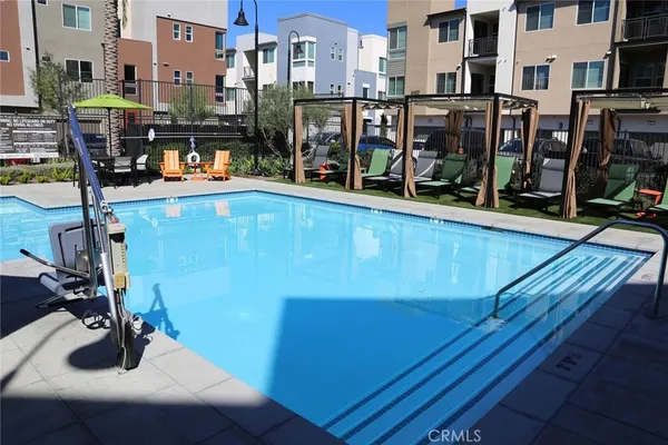 a view of a swimming pool with a sitting space