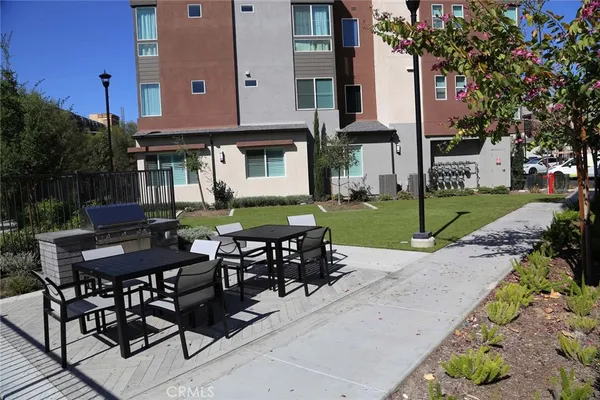 a view of a chairs and table in the patio