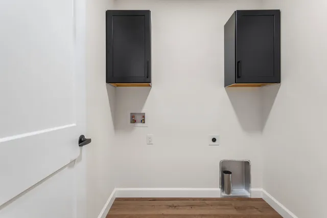 a view of a room with wooden floor