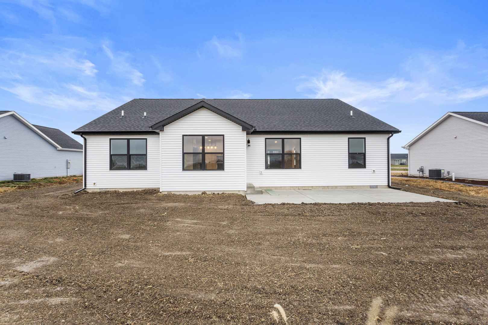 513 Patterson Drive Fisher, IL 61843 - Photo 23 of 25 a front view of a house with a garden