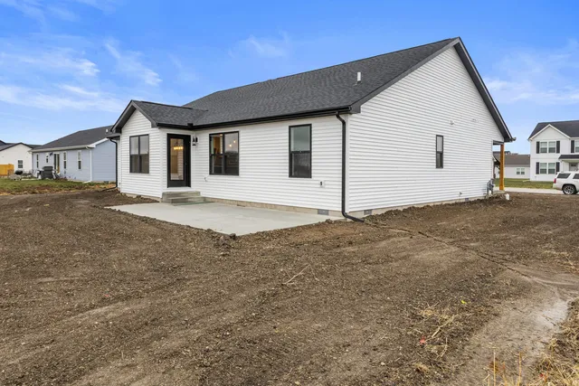 a picture of a open kitchen with a white wall and white walls