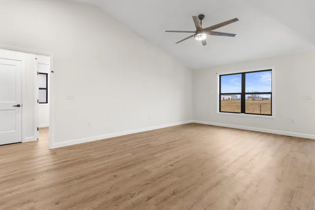 a view of a kitchen with wooden floor