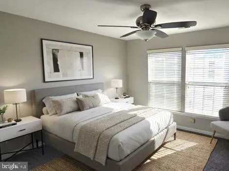 a bedroom with bed and a window