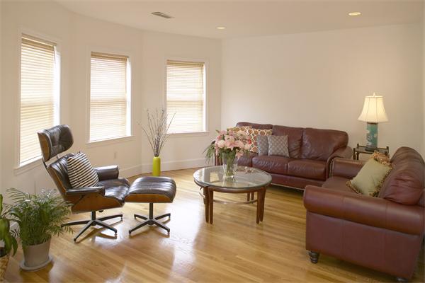 28 Surrey Street, Unit 3 Cambridge, MA 02138 - Photo 3 of 6 a living room with furniture and wooden floor