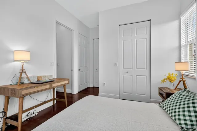 a bedroom with a bed and a table