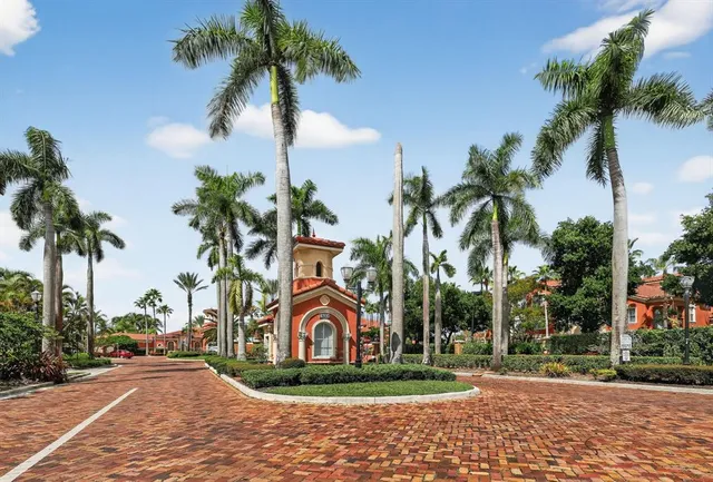 a sign board with palm trees
