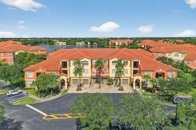 an outdoor space with swimming pool and furniture