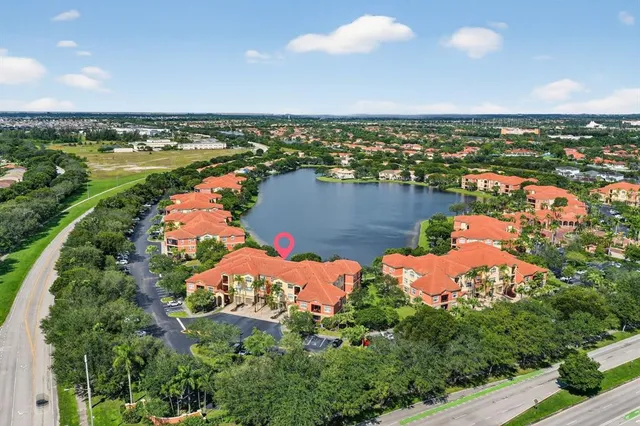 an aerial view of city and lake