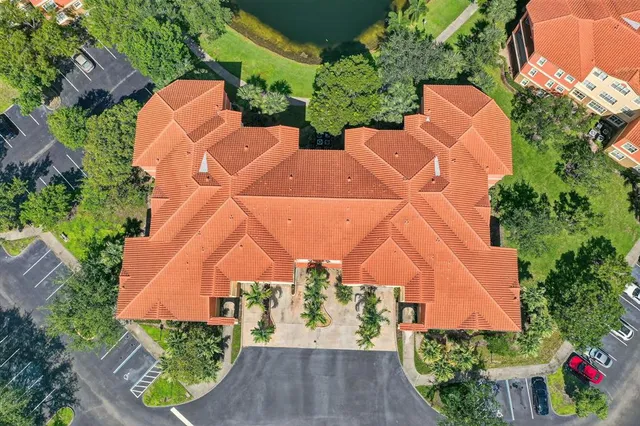 an aerial view of multiple houses with yard