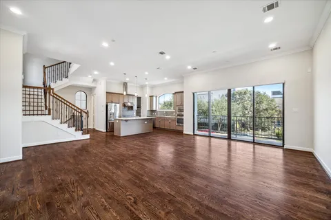a view of a kitchen with a ocean view and wooden floor