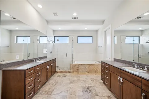 a large bathroom with a sink and a large mirror