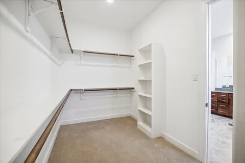 a view of an empty walk in closet