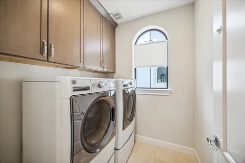 a view of a kitchen with washer and dryer