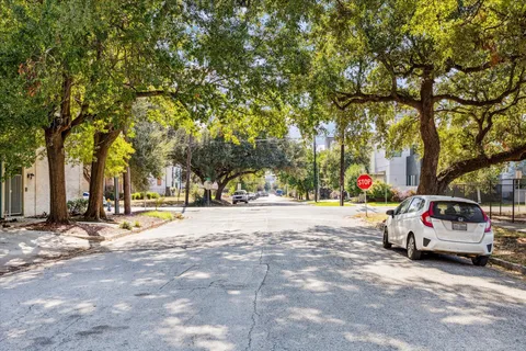 a view of street with parked cars