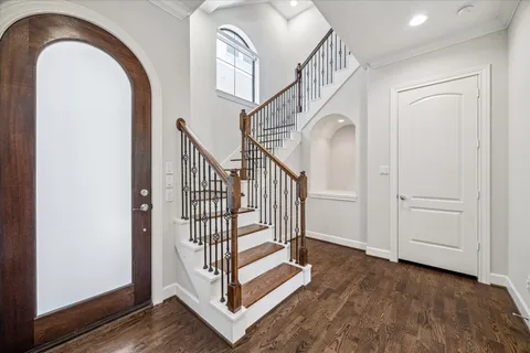 a view of entryway with wooden floor and window