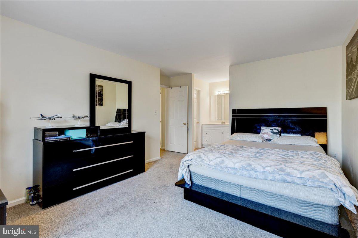 9562 Cannoneer Court, Unit 202 Manassas, VA 20110 - Photo 14 of 26 Primary Bedroom
