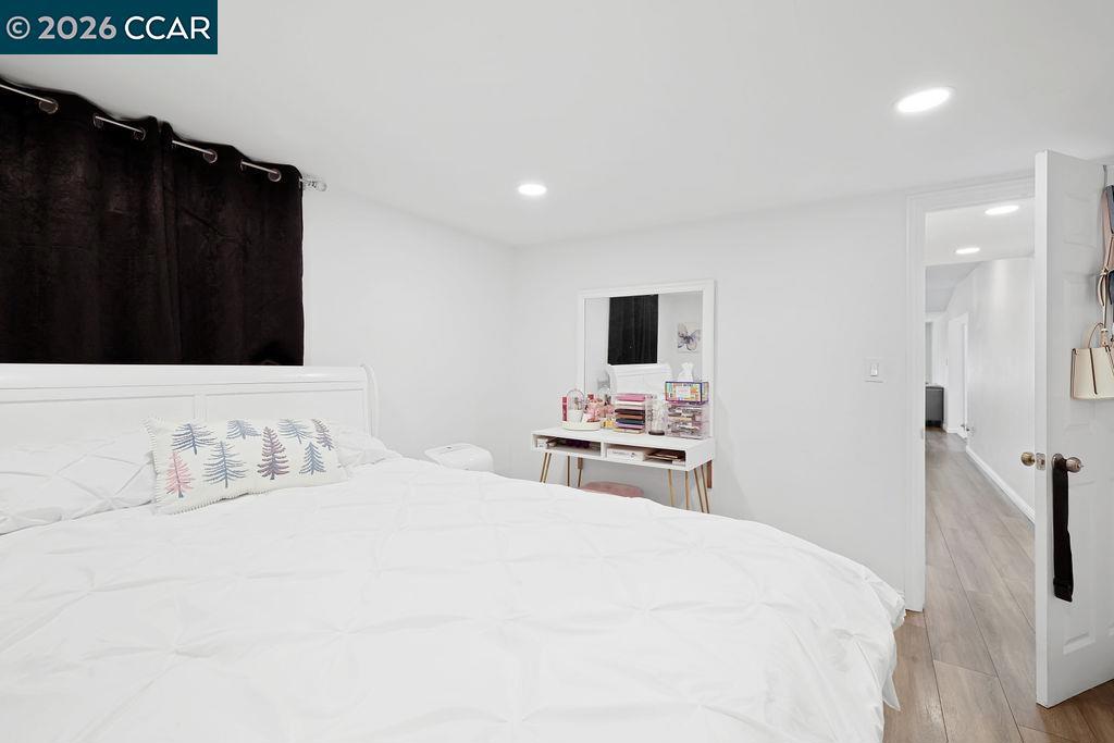 3301 Buchanan Road Antioch, CA 94509 - Photo 14 of 26 a bedroom with a bed and a flat tv screen on dresser