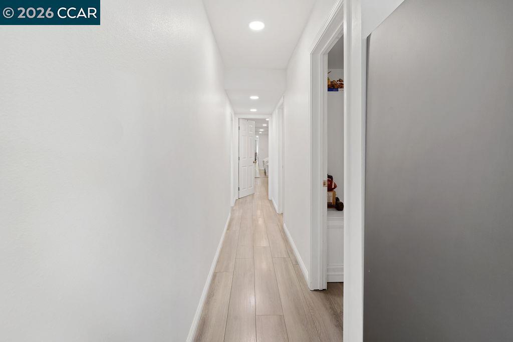 3301 Buchanan Road Antioch, CA 94509 - Photo 10 of 26 a view of a hallway with wooden floor