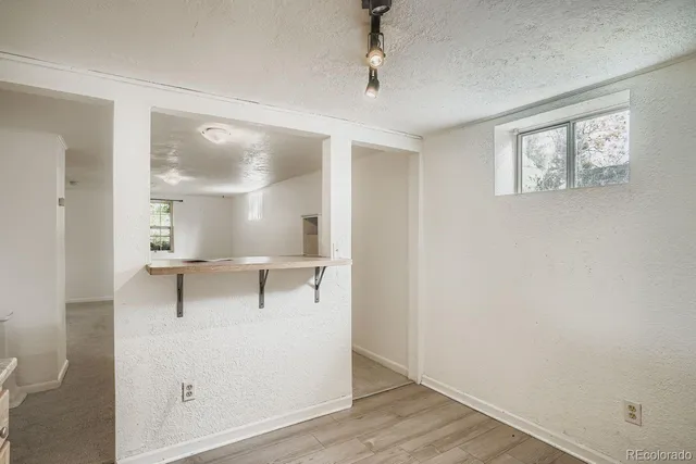 a view of cabinets and wooden floor
