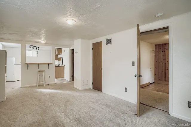 a view of a livingroom with cabinet