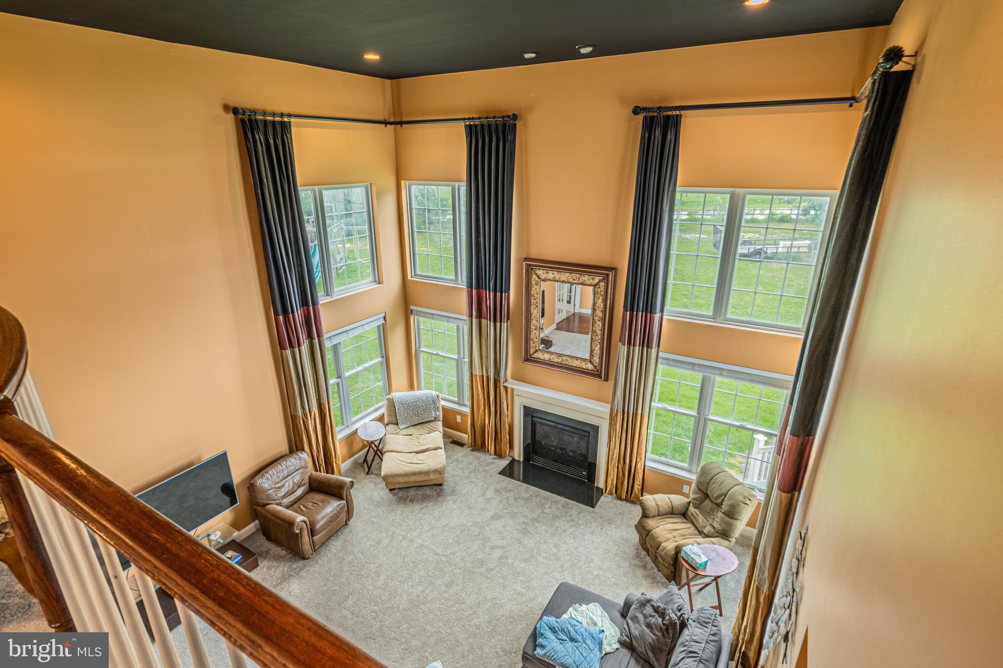 129 Blue Meadow Lane Sicklerville, NJ 08081 - Photo 13 of 25 a living room with furniture and a floor to ceiling window