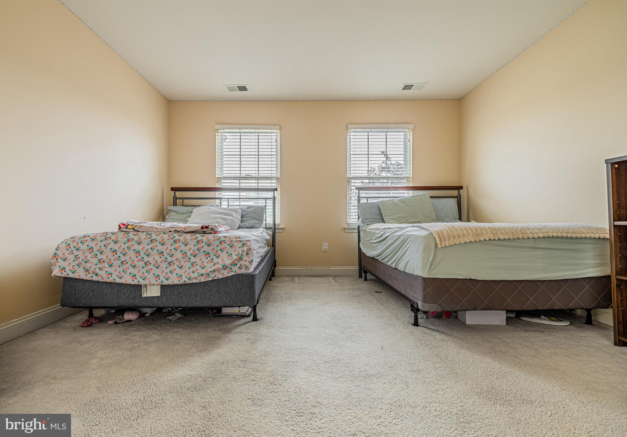 129 Blue Meadow Lane Sicklerville, NJ 08081 - Photo 17 of 25 a bedroom with a bed and wooden floor