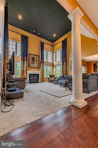 a view of a livingroom with furniture and a fireplace