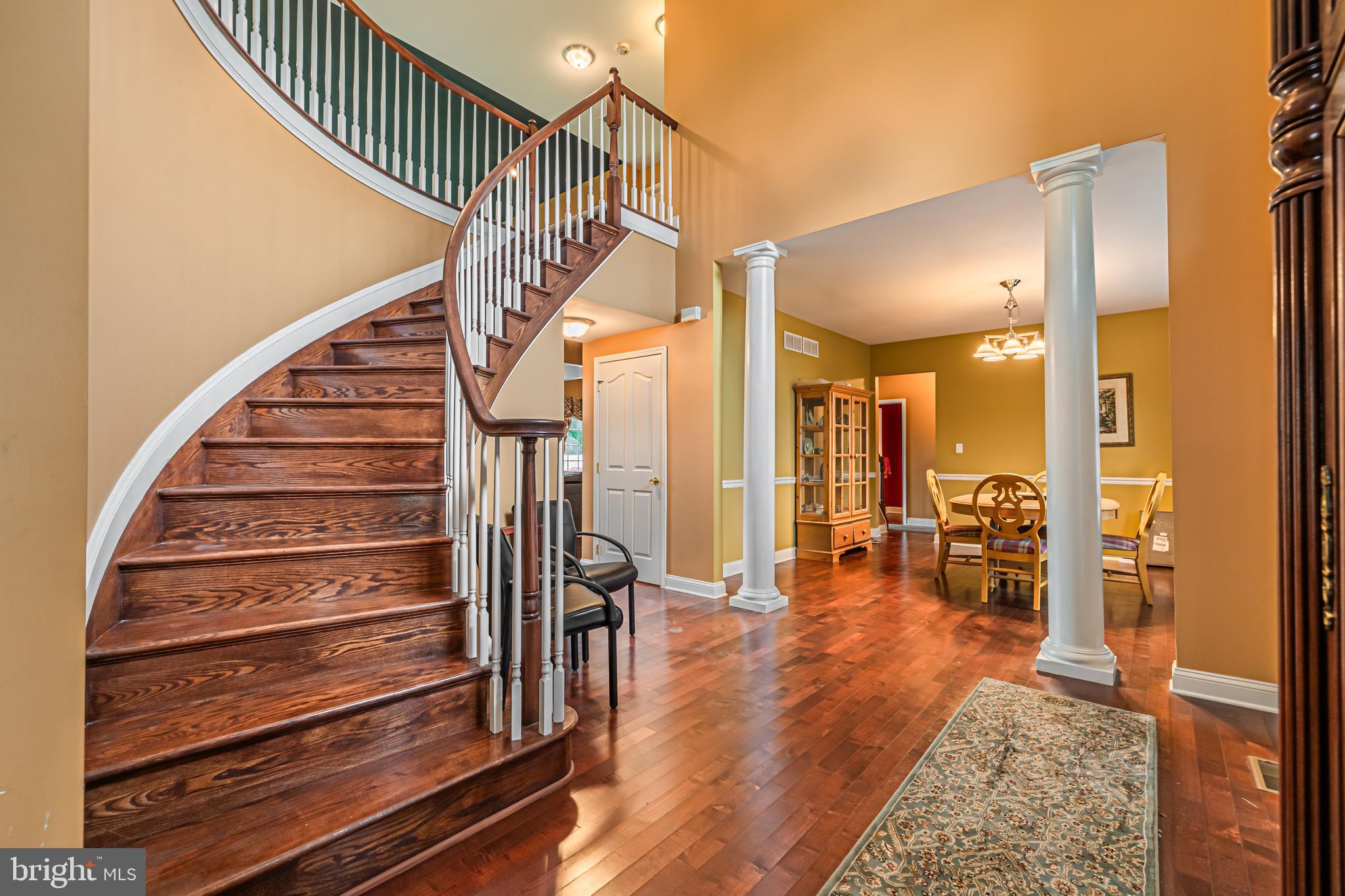 129 Blue Meadow Lane Sicklerville, NJ 08081 - Photo 2 of 25 a view of entryway and hall with wooden floor