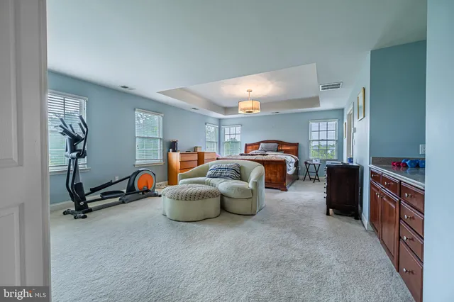 a bed room with furniture and a window