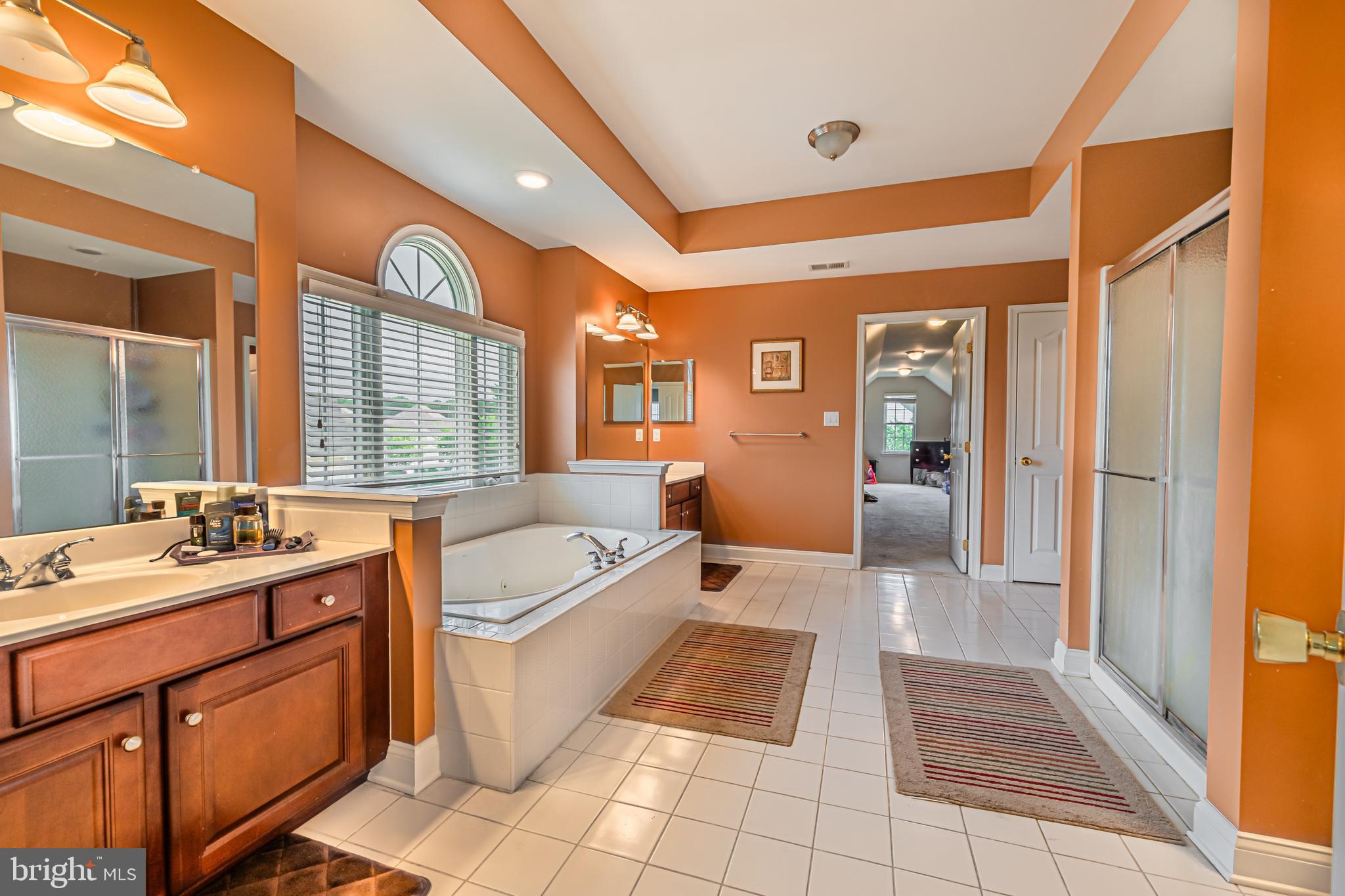 129 Blue Meadow Lane Sicklerville, NJ 08081 - Photo 7 of 25 a spacious bathroom with a tub sink and mirror